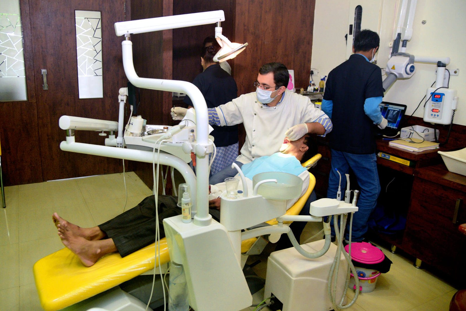 Dr Premdeep Gandhi performing clinical examination with digital RVG system